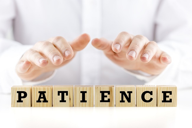 Mot patience écrit en lettres de scrabble
